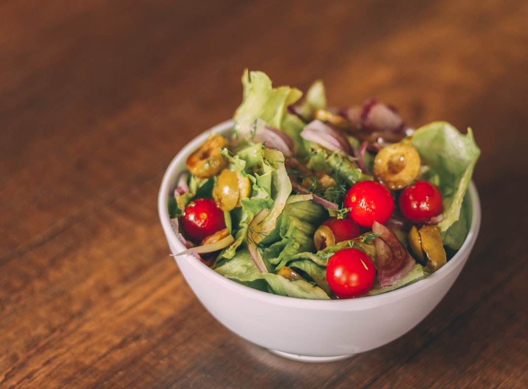 Buddha bowl with quinoa, chickpeas, greens and tahini dressing